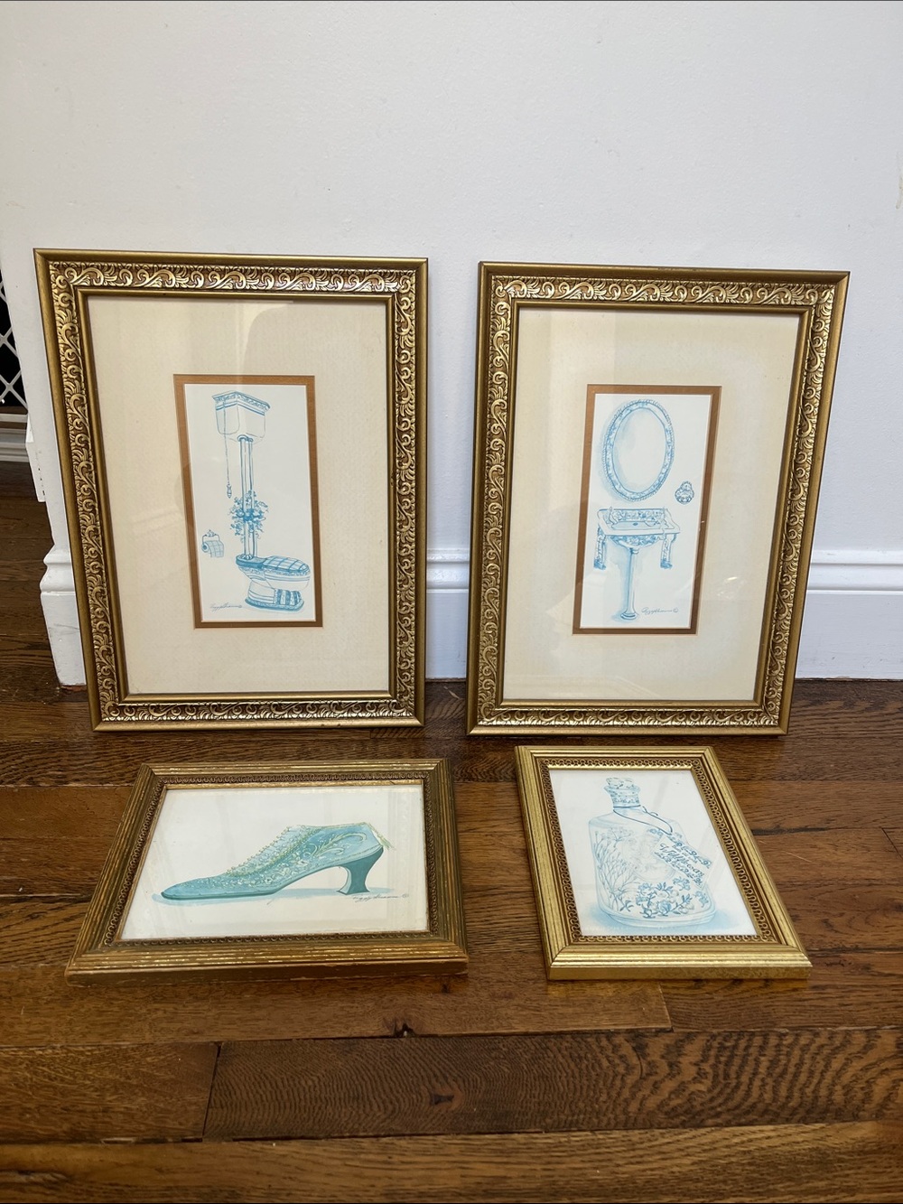 4 gold framed pictures